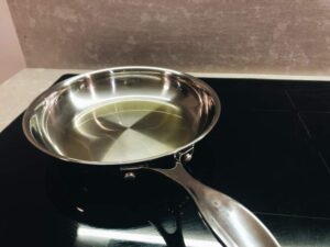 Olive oil in a stainless steel frying pan