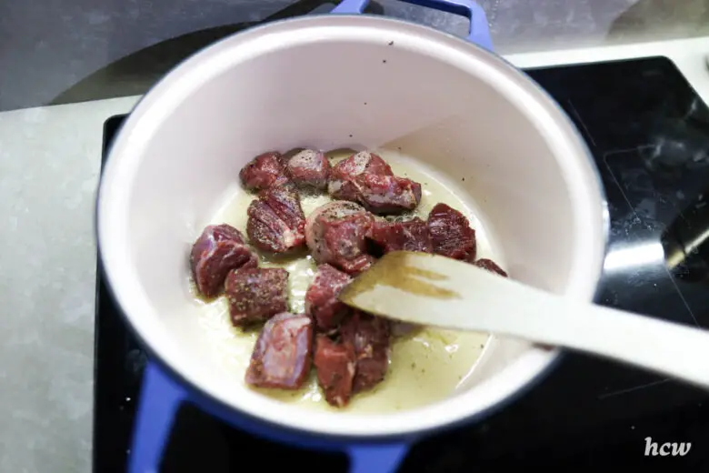 Searing cubes of beef in the Misen Dutch oven
