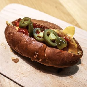 Photo of a cheddar jalapeño hot dog
