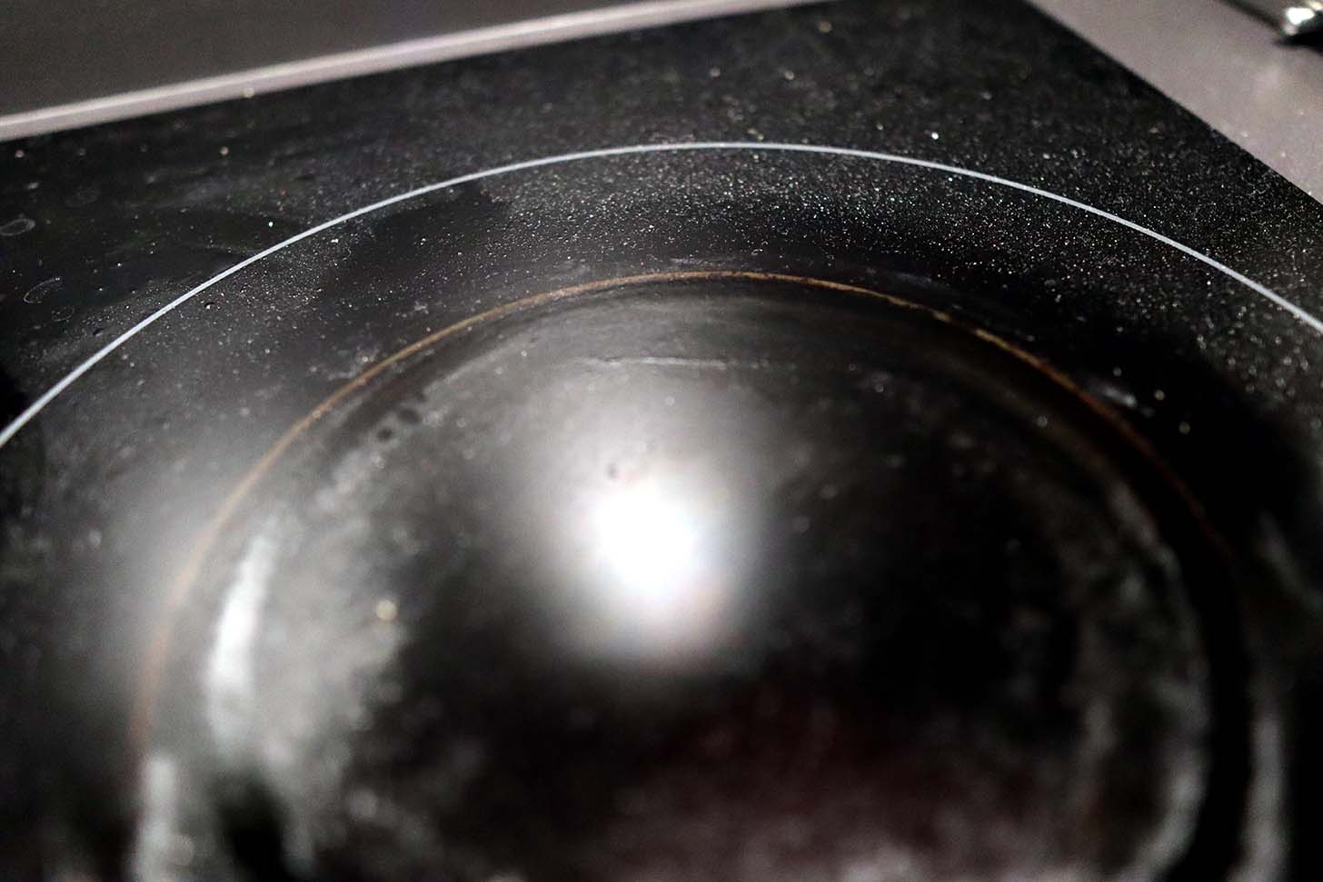 A photo of the stains left on my induction cooktop after cooking with a cast iron skillet with an oily underside.